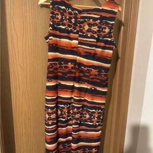 comfortable dress with small opening in the back. Made in Vietnam.